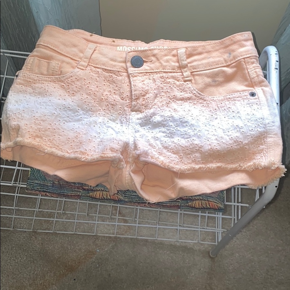 Peach and white shirt, shorts.